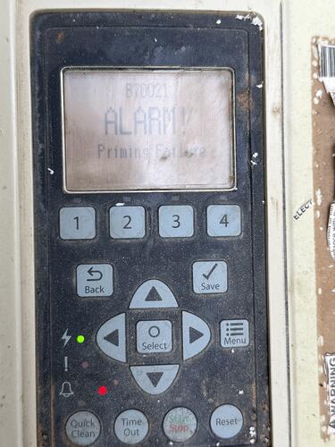 Pool pump control panel showing priming alarm